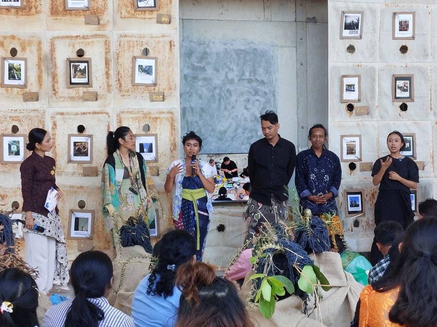 Kala Loka artists sharing their work with an audience at Kitapoleng, with a sign language interpreter beside them